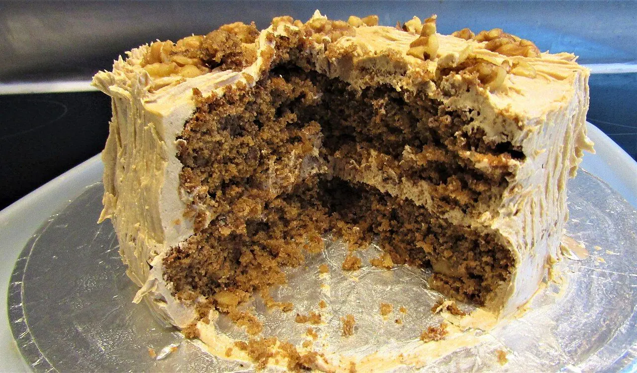 A coffee and walnut sponge cake prepared in a kitchen in the village of Trimingham , Norfolk, England.