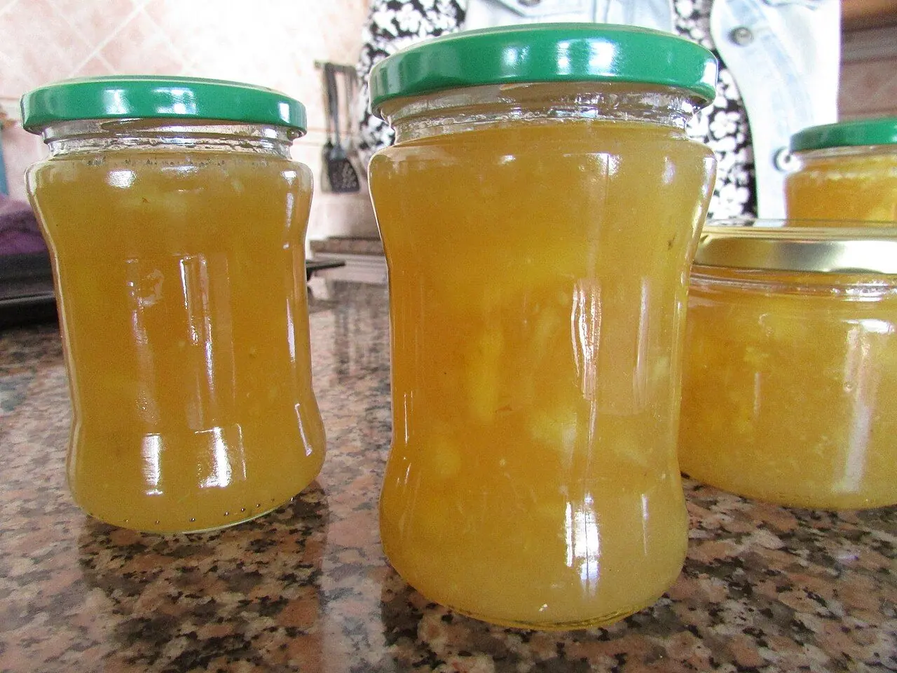 Jars of homemade pineapple jam prepared in a kitchen in the village of Trimingham , Norfolk, England.