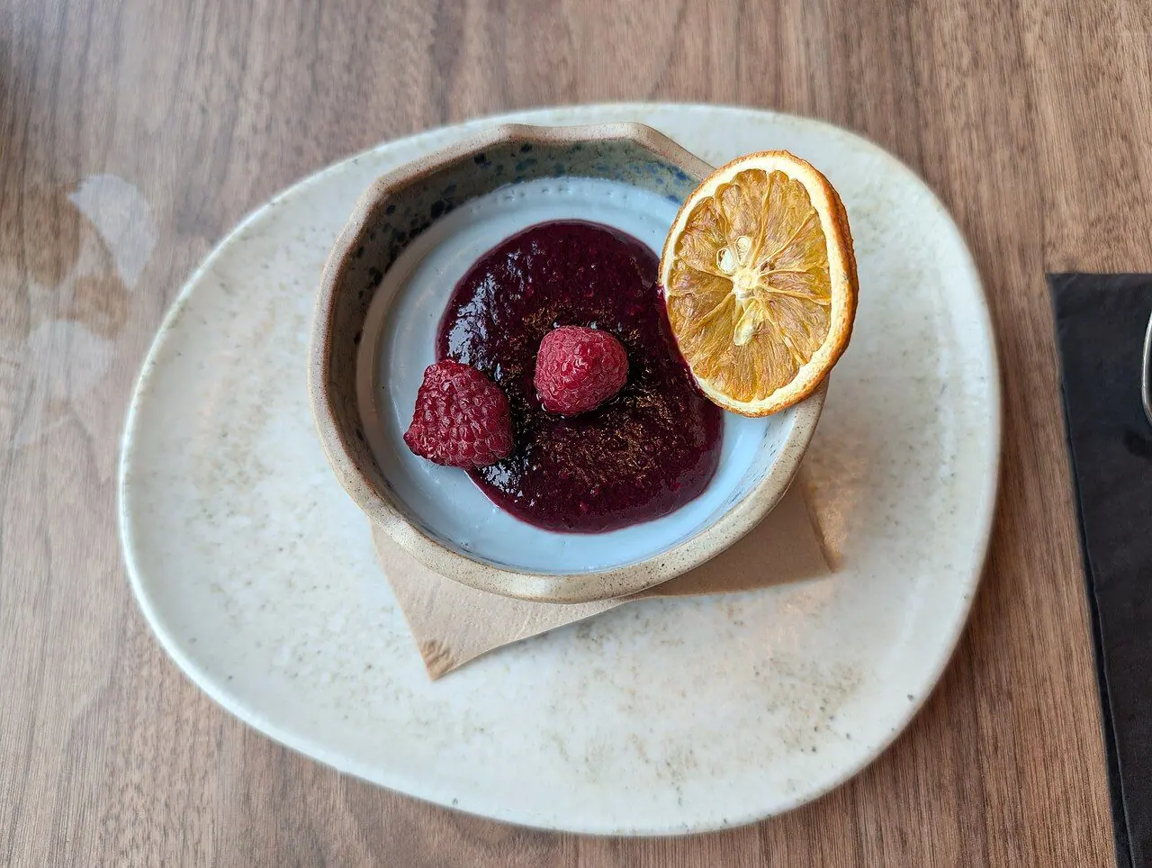 Description on menu: "Silky panna cotta infused with elderflower, topped with blueberry compote"
