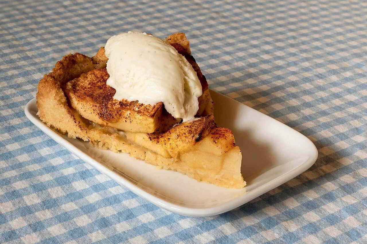 Simple and easy apple pie served with vanilla ice cream, on a gingham tablecloth in Lysekil, Sweden. Image focus stacked from five photos using Photoshop. Recipe : Ingredients : 150 g butter, 1 dl sug